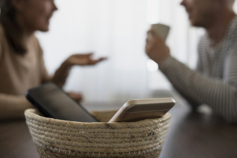 People on meeting without their phones. Digital detox challenge, basket